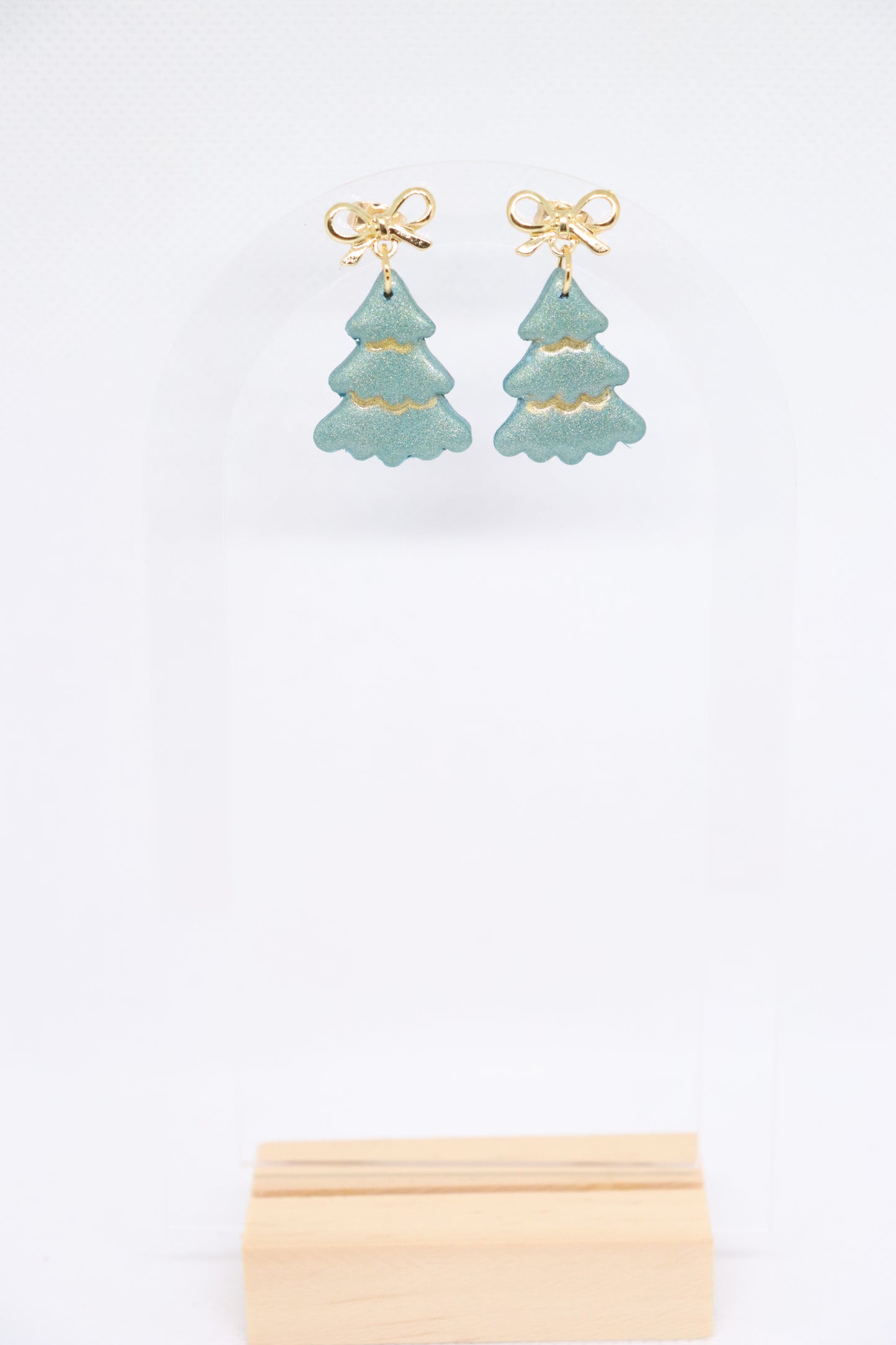 Groene kerstboomoorbellen strik