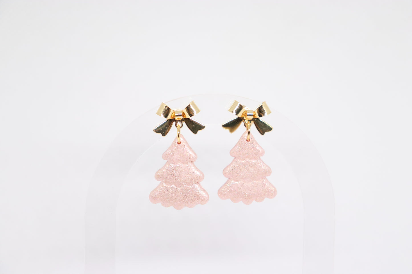 Roze kerstboomoorbellen strik