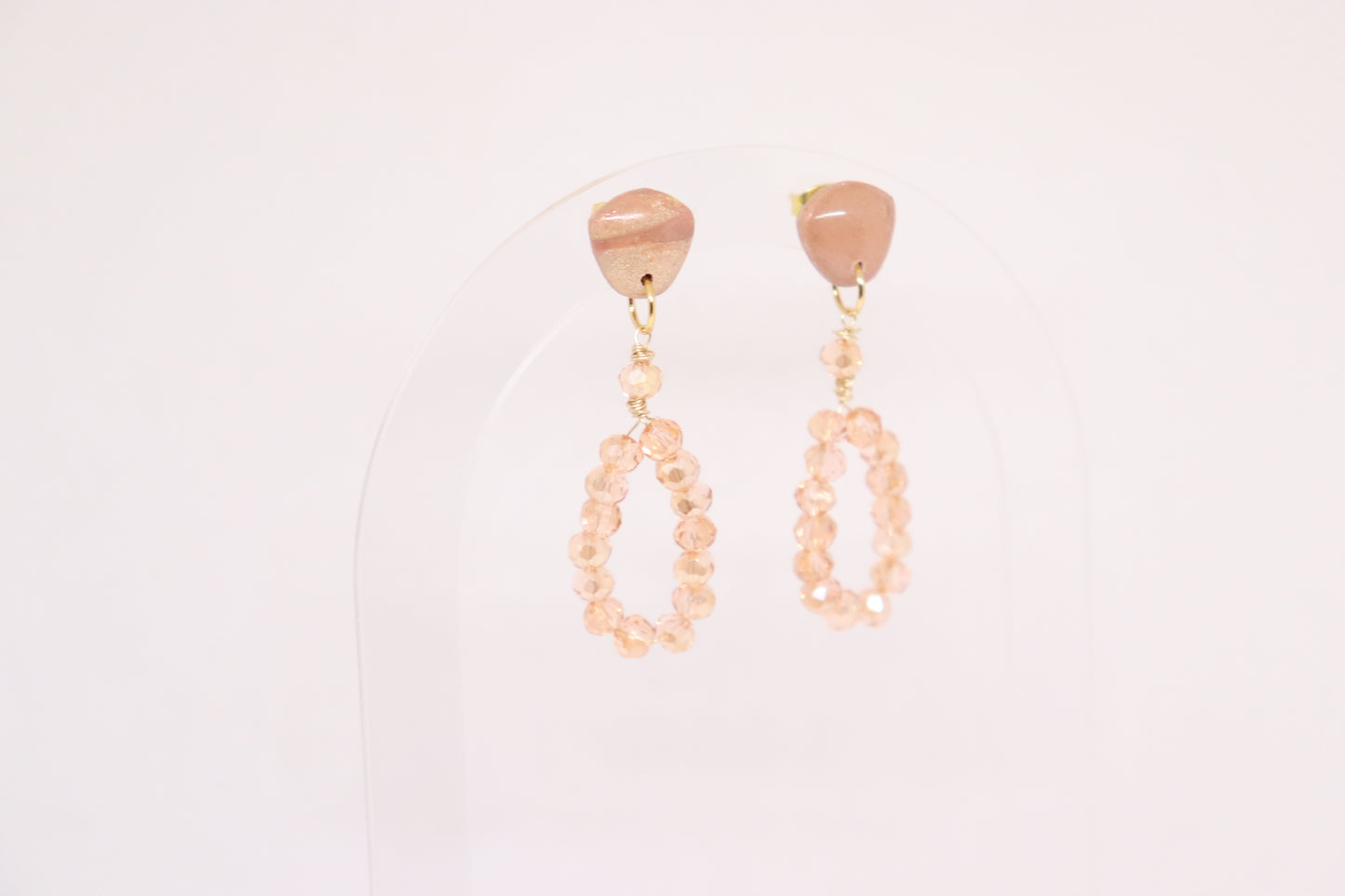 Beige oranje bon bon oorbellen